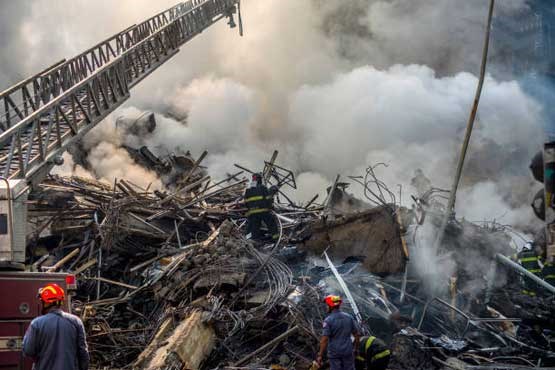 ناپدید شدن ۴۴ نفر بر اثر ریزش ساختمان +عکس