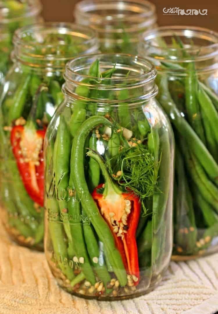 طرز تهیه ترشی لوبیا سبز و آموزش مرحله به مرحله آن سرکه درون شیشه لوبیا سبز