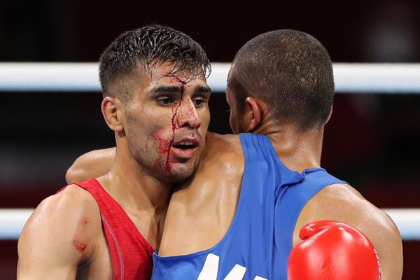 صورت خونین ورزشکار ایرانی در المپیک (عکس) صورت خونین ورزشکار ایرانی در المپیک (عکس)