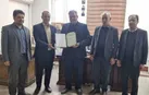 تحویل تمامی اسناد تملکی منابع طبیعی به رئیس بنیاد مسکن اشکذر