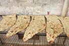 نان در تنور داغ کم‌فروشی و گرانفروشی